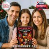 Smiling family holding the Rock Music Duck Advent Calendar 2025 box in front of a Christmas tree!
