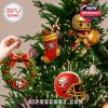 San Francisco 49ers themed Christmas ornaments including a wreath helmet and stocking hanging on a Christmas tree!