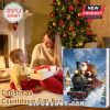 Mother giving child a Santa train Advent calendar near Christmas tree.