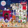 Snoopy advent calendar and holiday figures displayed next to a decorated red doghouse at night!