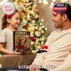 Father and daughter holding the System of a Down Advent Calendar 2025 box next to a Christmas tree!