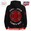 Back of a black hoodie with a large firefighter Maltese cross emblem.