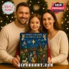 Smiling family holding a Birth of Jesus Advent Calendar together!
