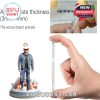 Hand holding thick acrylic ornament with Toby Keith figure