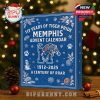 A bold blue Memphis Tigers advent calendar box with holiday artwork, placed in a decorated Christmas room!