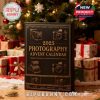 Warm holiday scene featuring a camera-themed advent calendar surrounded by wrapped presents and Christmas décor—suggesting it as a stylish, thoughtful seasonal gift!
