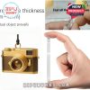 A high-detail view of a golden ornament representing a compact camera, complete with hanging loop and fine finishes. Also shown is the scratch-resistant build quality and real acrylic thickness!