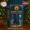 A rectangular Auburn Tigers 2025 advent calendar with festive artwork including stadium seats, wrapped gifts, and detailed golden borders, set in a warm Christmas environment!