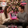 Happy couple exchanging BLACKPINK advent calendar in a cozy Christmas setting!