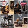 Four Bob Dylan figurines posed with guitars and microphones in various performing styles with matching boxes and 3D modeling scenes behind!