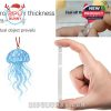 Blue jellyfish acrylic ornament and a demonstration of its thickness and sturdy design in a hand-held view!