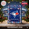 Festive holiday photo of a Toronto Blue Jays Advent Calendar surrounded by lights and holiday decor, set outdoors near a stadium to emphasize its seasonal spirit!