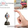 Zoomed view of a Toronto Blue Jays trophy-style ornament and a demonstration of its acrylic thickness with hand reference, highlighting durability and craftsmanship!