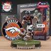 Denver Broncos figure sprinting mid-air with Bengals defender attempting tackle, displayed on grass-effect base with box art and team logo!