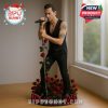 A collectible figurine of a male singer in a black vest and trousers, holding a microphone stand entwined with roses, standing on a base filled with red roses. A festive product label from Bipu Bunny is displayed!