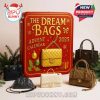 A red and gold Dream Bags Advent Calendar with luxury-inspired mini handbags displayed around it, creating a chic holiday presentation perfect for collectors and fashion fans!