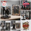 Fleetwood Mac figurines in action poses, beautifully packaged in floral-themed boxes.
