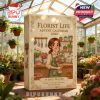 Florist Life Advent Calendar 2025 box in a bright greenhouse with lush plants and flowers in the background.