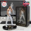 Freddie Mercury figurine in white tank top and pants, holding microphone, displayed in black and gold box.