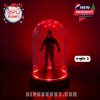 Style 2 design featuring a minimalist horror figure illuminated by glowing red LEDs inside a transparent dome, sitting on a black base. A sinister yet stylish piece of decor.
