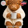 Comfy cow figurine in bathrobe sipping coffee, blending humor and coziness with handcrafted details!
