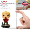 Detailed Kevin McCallister ornament beside hand showing durable acrylic thickness and peelable protective film.