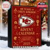 NFL-themed advent box with football design set in a Christmas store window with snow and holiday ornaments!