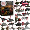Military-themed advent calendar featuring U.S. military vehicles and ships with holiday decorations such as bows and bells.