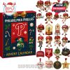 An advent calendar featuring the Philadelphia Phillies logo with 24 compartments containing mini figures and memorabilia like baseballs, rally towels, and World Series trophies.