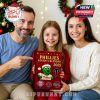 A family enjoying the 2025 Phillies Advent Calendar together in front of a Christmas tree, perfect for Phillies fans looking to count down the days to Christmas.