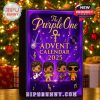 Holiday-themed advent calendar box featuring musical details and a deep purple design, placed in front of a lit Christmas tree!