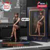 Taylor Swift “The Life of a Showgirl” figure in black gown seated pose, placed on light-accented base beside luxury package!