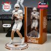 Arch Manning Texas Longhorns figure in white jersey ready to throw, on name-labeled base beside official collector packaging!