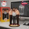 A collectible figure of The Kinks with members in orange and blue retro shirts, posed on a display base with their band name. The scene includes their digital 3D model on a large screen and packaging nearby, suggesting behind-the-scenes production!