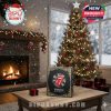 The Rolling Stones advent calendar in front of a decorated Christmas tree and fireplace.