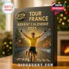 Close-up of Tour de France Advent Calendar 2025 with cyclist on cover and Christmas decor around.