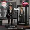 Billy Gibbons collectible posed on a desk beside his boxed edition, with guitar and microphone in hand!