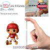 Detailed view of a mini Chiefs football character ornament and a hand measuring the product thickness, highlighting quality and material!