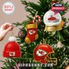 Chiefs-themed holiday ornaments hanging on a Christmas tree, showcasing team spirit through decorative elements!