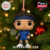 Cartoon-style male tennis ornament in blue uniform with tennis racket and holiday hanging loop!