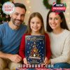 A family portrait in a holiday-decorated room, with the child holding the Music Advent Calendar box. The image evokes warmth, joy, and anticipation of daily Christmas surprises!