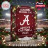 2025 Alabama Crimson Tide Advent Calendar box featured in a holiday-themed setting with stadium lights and pine decorations!