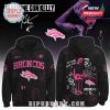 A black hoodie with Denver Broncos logo, featuring custom pink designs and Machine Gun Kelly’s artistic touch.
