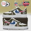 San Francisco 49ers custom sneakers with camouflage design, pink swoosh, and American flag details. The sneakers feature the NFL logo, U.S. Veterans tribute, and space for personalization.