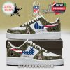 Dallas Cowboys custom sneakers featuring camouflage design, pink swoosh with American flag, and NFL logo. The shoes are a tribute to U.S. veterans and offer space for personalization.