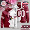 Custom hoodie featuring a split design with the Arizona Cardinals logo on the front and a personalized name and number on the back. The hoodie blends the team’s colors and NFL branding for a stylish and comfortable look.