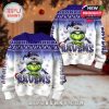 Front and back of Baltimore Ravens Grinch sweater shown together in festive room.