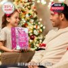 A heartwarming family exchange centered around the bright, joyful Barbie holiday calendar in front of a beautifully decorated Christmas tree!