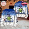 Front and back of Bills Grinch Christmas sweater with blue-to-white snow knit, team logo Santa hat, and colorful light trim in cozy decorated room!
