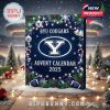 BYU Cougars Advent Calendar 2025 box surrounded by snow, ornaments, and Christmas lights, creating a festive vibe!